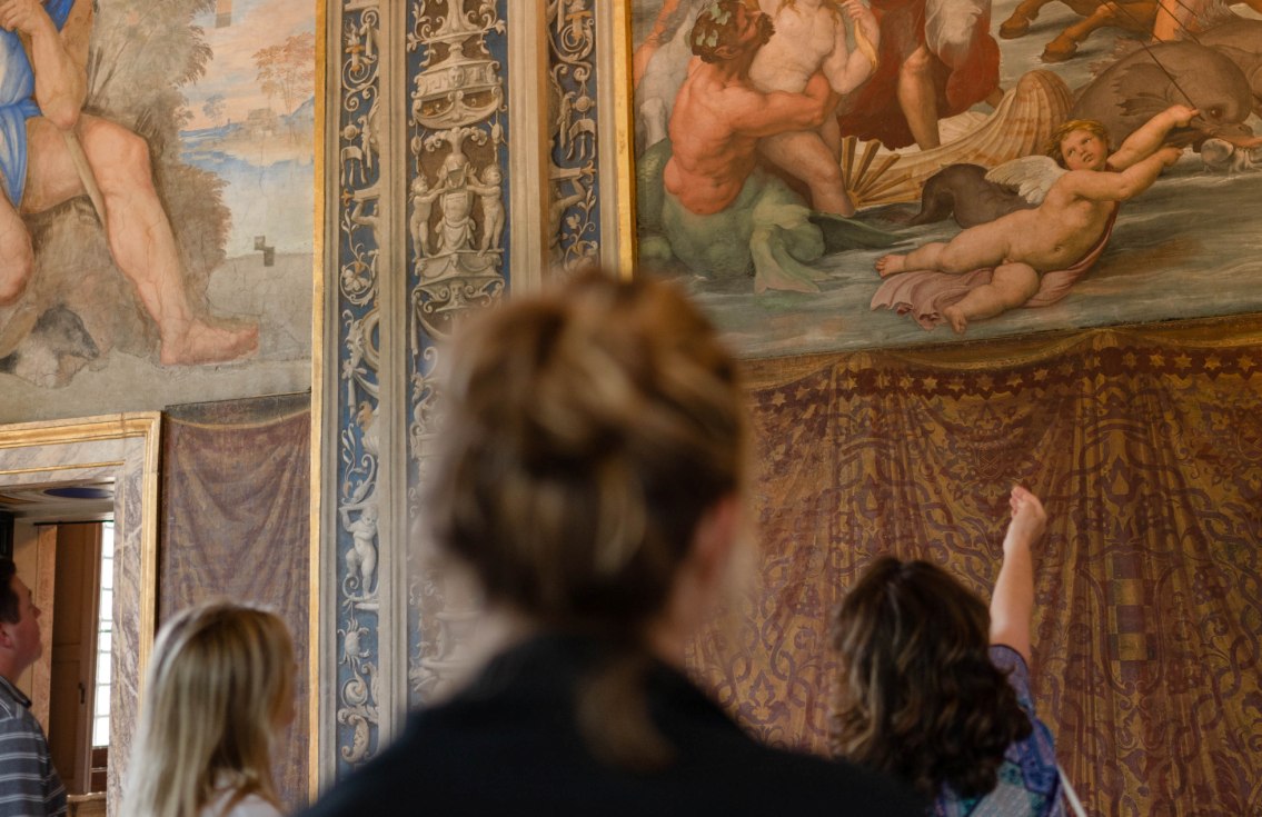 Class looking at frescos by Raphael