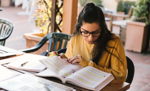 Student reading books and documents