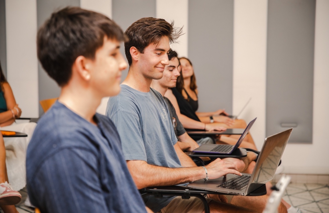 Students in class with laptop