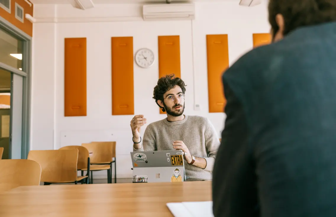 Student with professor in a classroom