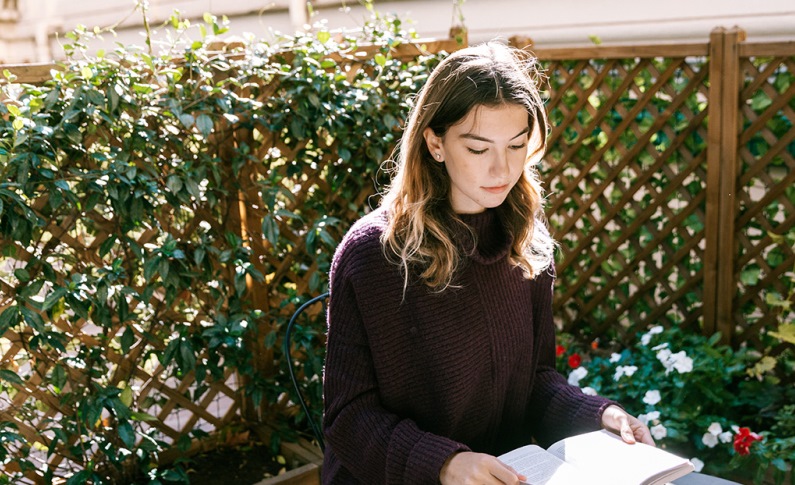 Student studying the garden