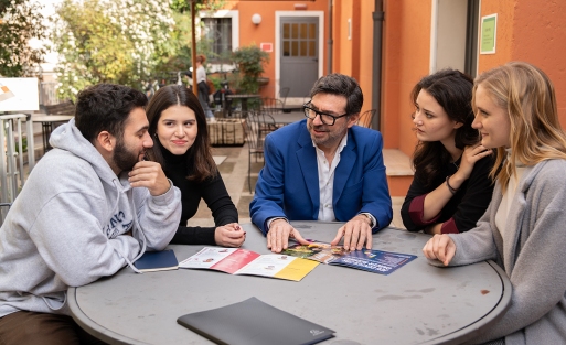 Professor and students talking