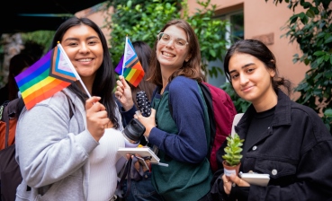 Two JCU Students leaving a building while talking to one another