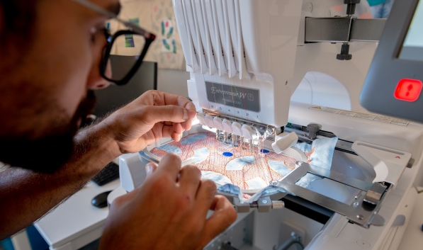 Student with sewing machine