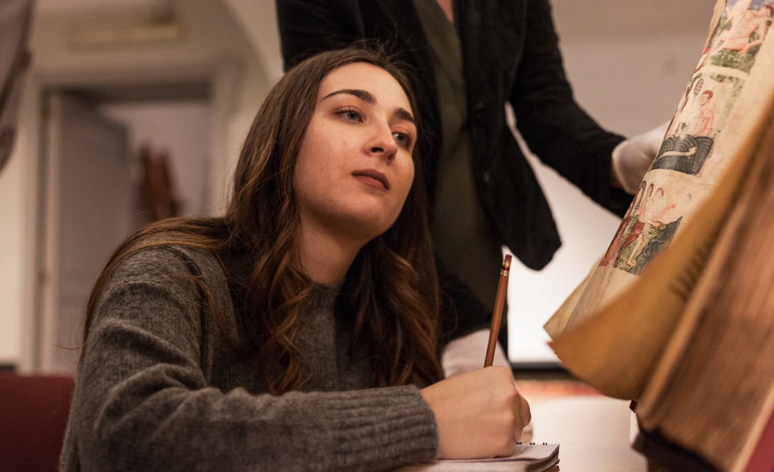 Student examines a book