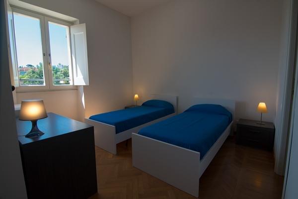 A bedroom in a Gianicolo Residence apartment