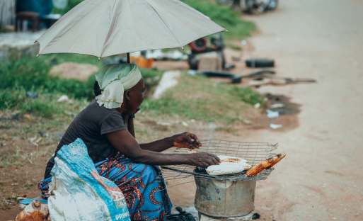 A woman cooking in the street
