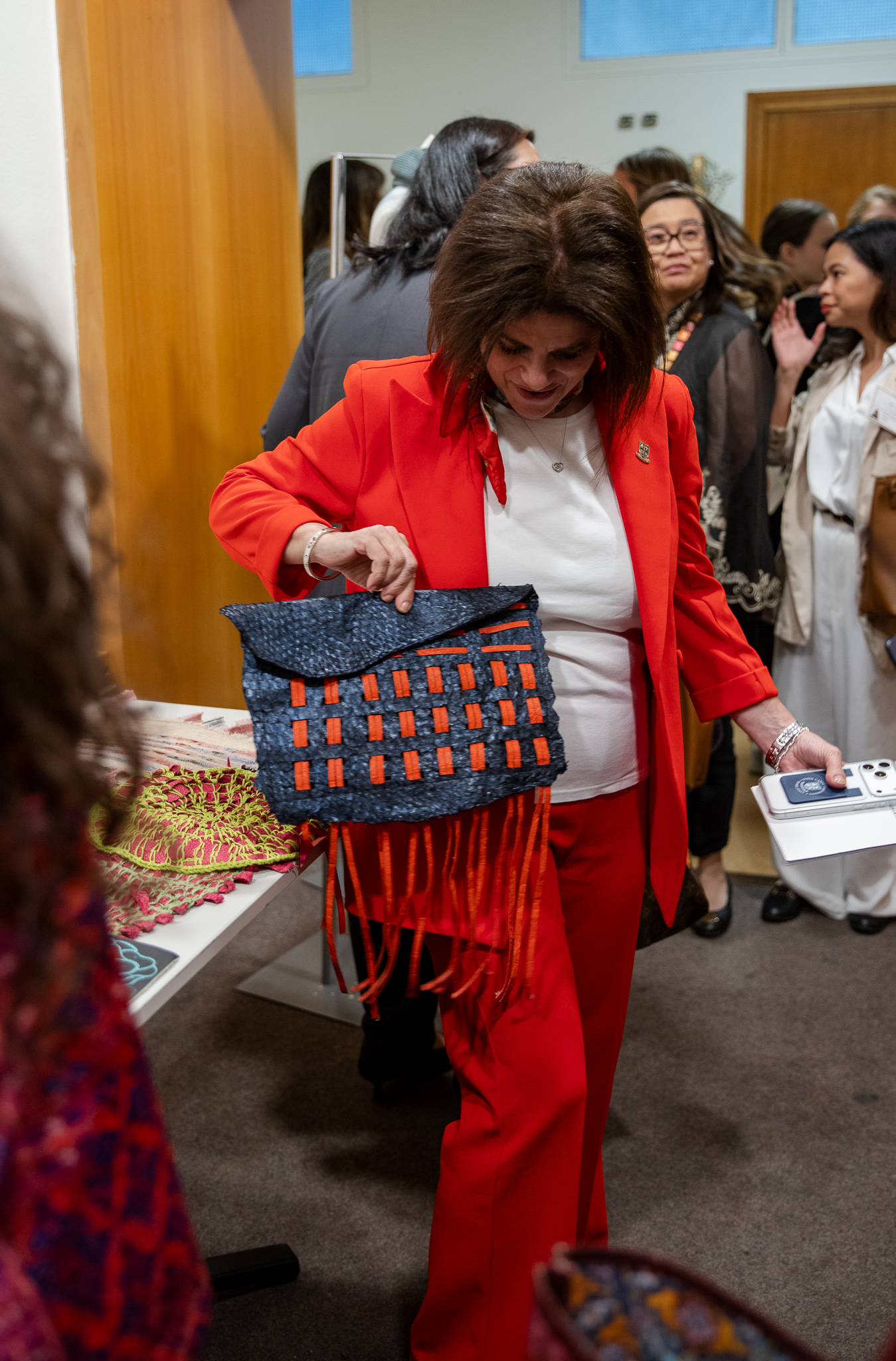President Maioni with a bag designed by the students